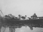 Alaskan Native People on a Canoe by George Fox University Archives