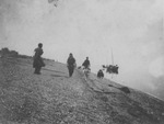 Native Alaskan People on Beach with Dog by George Fox University Archives