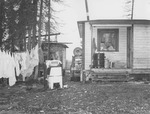 House in Alaska with Clothes Drying on a Line by George Fox University Archives