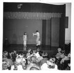Male and Female Perform Together on Stage by George Fox University Archives