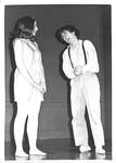 Male Laughs with Hands Together and Looking at Female by George Fox University Archives