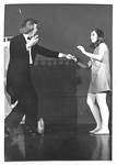 Female Dances with Man in Black Tuxedo by George Fox University Archives
