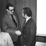 Director of Development Maurice Chandler shakes hands with Secretary of State Clay Myers by George Fox University Archives