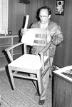 Ron Crecelius moves chair in office by George Fox University Archives