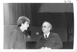 Ron Crecelius talks with student by George Fox University Archives