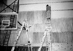 Construction of Coach Lorin Millers new office in Hester Gym by George Fox University Archives