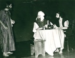 Three men act in performance
