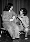 Male and female wear matching striped outfits and talk by George Fox University Archives