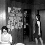 Staff members work in office by George Fox University Archives