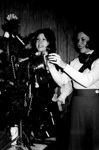 Staff members decorate office Christmas tree by George Fox University Archives
