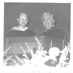Two Men Smiling Behind a Podium at the Fall Convocation in 1972 by George Fox University Archives