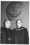 Two Men Standing and Smiling at the Fall Convocation in 1973 by George Fox University Archives