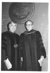 Two Men Standing and Smiling at the Fall Convocation in 1973 by George Fox University Archives