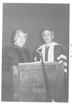 Two Men Standing and Smiling at the Fall Convocation in 1974 by George Fox University Archives