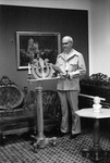 Man stands in corner behind podium by George Fox University Archives