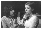 Male actor holds chin of female by George Fox University Archives