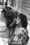 Female applies face makeup on another female by George Fox University Archives