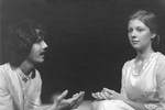 Male actor holds hands out and looks at female actress by George Fox University Archives