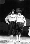 Tweedledee and Tweedledum stand with arms around eachother's shoulders by George Fox University Archives