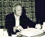 CFO Don Millage does paperwork at his desk by George Fox University Archives