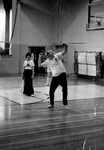 Sam Willard demonstrates tennis by George Fox University Archives