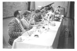 People Sitting at an Alumni Dinner by George Fox University Archives