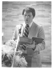 Man Reading Behind a Podium at a Class Reunion by George Fox University Archives
