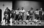Men cast members perform a dance by George Fox University Archives