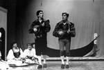 Two male students perform musical piece in play