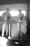 Bill Loewen, Bookstore Wood Carver, with Ron Crecelius, Chaplain, at Podium Bill made for chapels by George Fox University Archives