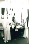 Susie McCarty sits at her desk