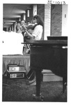 Woman Playing the Violin at an Alumni Reception by George Fox University Archives