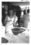 Woman Serving Punch at an Alumni Reception by George Fox University Archives