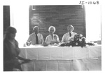 People Sitting at a Table at an Alumni Reception by George Fox University Archives