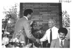 Man Shaking Another Mans Hand at an Alumni Reception by George Fox University Archives