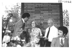 Man Speaking Behind a Podium at an Alumni Reception by George Fox University Archives