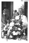 Man Speaking Behind a Podium at an Alumni Reception by George Fox University Archives