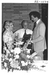 Person Presenting a Plaque at an Alumni Reception by George Fox University Archives