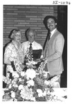People Standing Behind a Podium at an Alumni Reception by George Fox University Archives