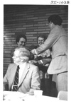 Man Presenting Plaques at an Alumni Reception by George Fox University Archives