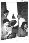 Man Shaking Another Mans Hand at an Alumni Reception by George Fox University Archives