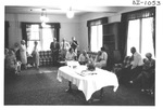 People gathering at an Alumni Reception by George Fox University Archives