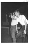 Man Filming at the Alumni Talent Show in 1983 by George Fox University Archives