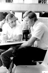 Coach Rich Allen and student by George Fox University Archives