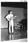 Man Playing the Guitar at the Alumni Talent Show in 1985 by George Fox University Archives