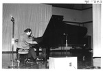 Man Playing the Piano at the Alumni Talent Show in 1985 by George Fox University Archives