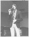 Man Singing at the Alumni Talent Show in 1987 by George Fox University Archives