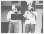 Two Men Performing at the Alumni Talent show in 1987 by George Fox University Archives