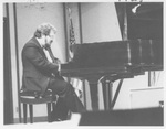 Man Playing the Piano at the Alumni Talent Show in 1987 by George Fox University Archives