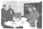 People Looking at Shirts at the Class of 1943 Reunion at Homecoming 1993 February by George Fox University Archives